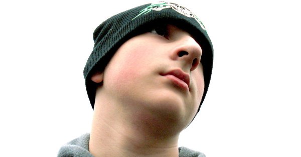 Teenage boy with knit cap.
