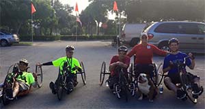 people handcycling