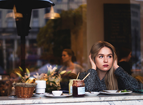 woman sitting at a cafe