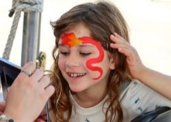 Kids with faces painted at natural areas festival