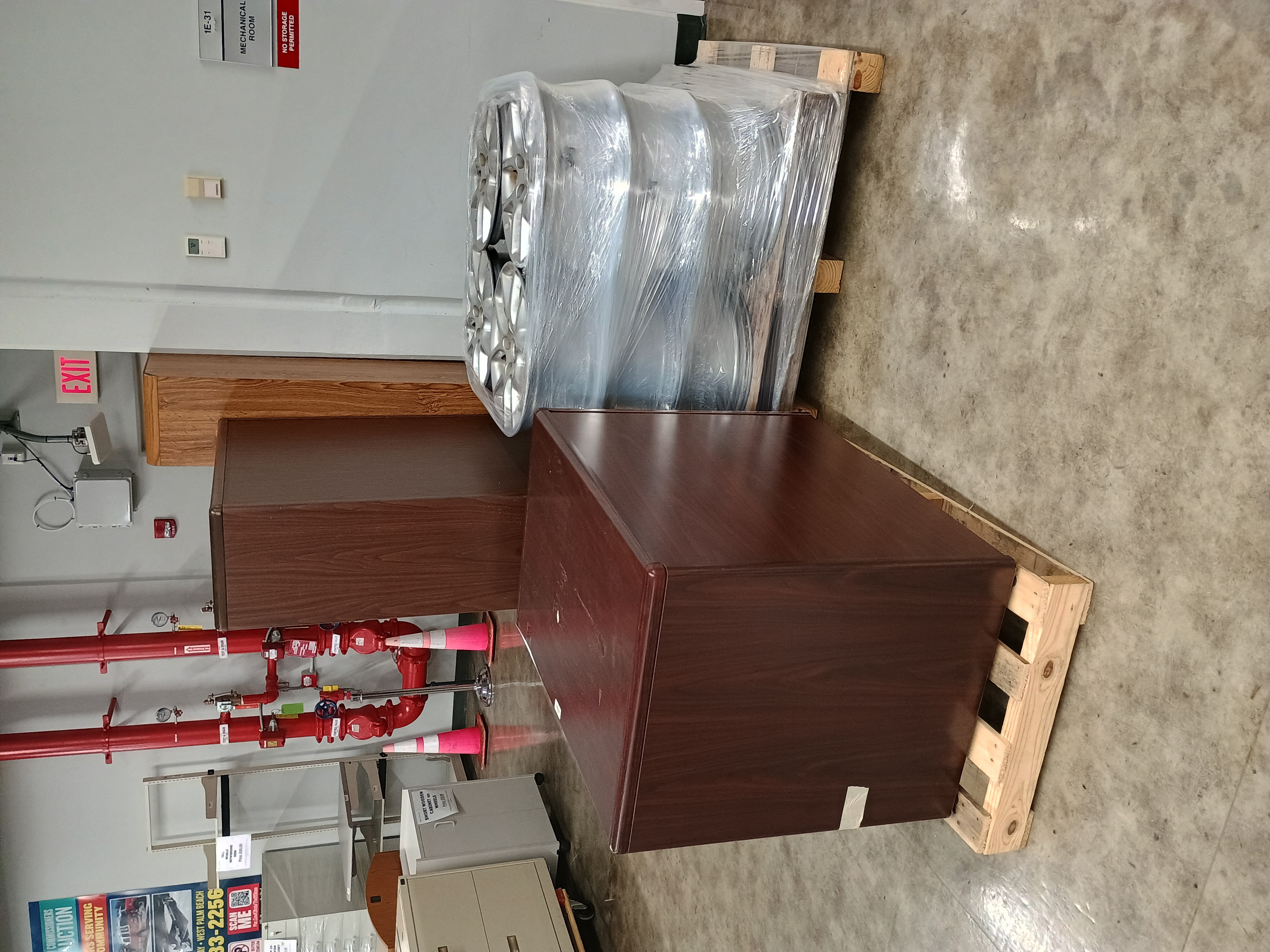 Bookshelves, two drawer file cabinet and pallet of vehicle rims.jpg