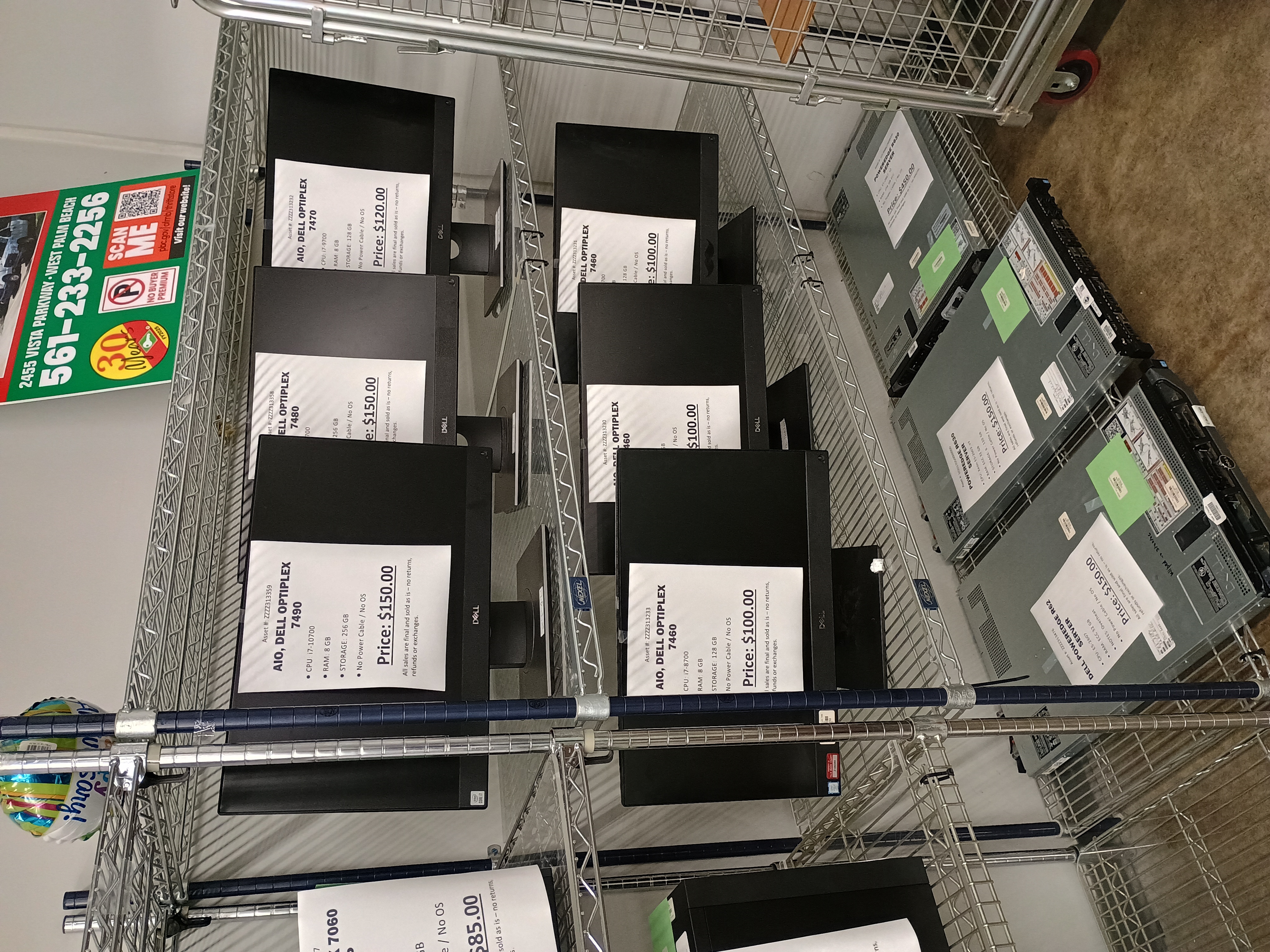 Several All in One and server computers on wire shelving.jpg