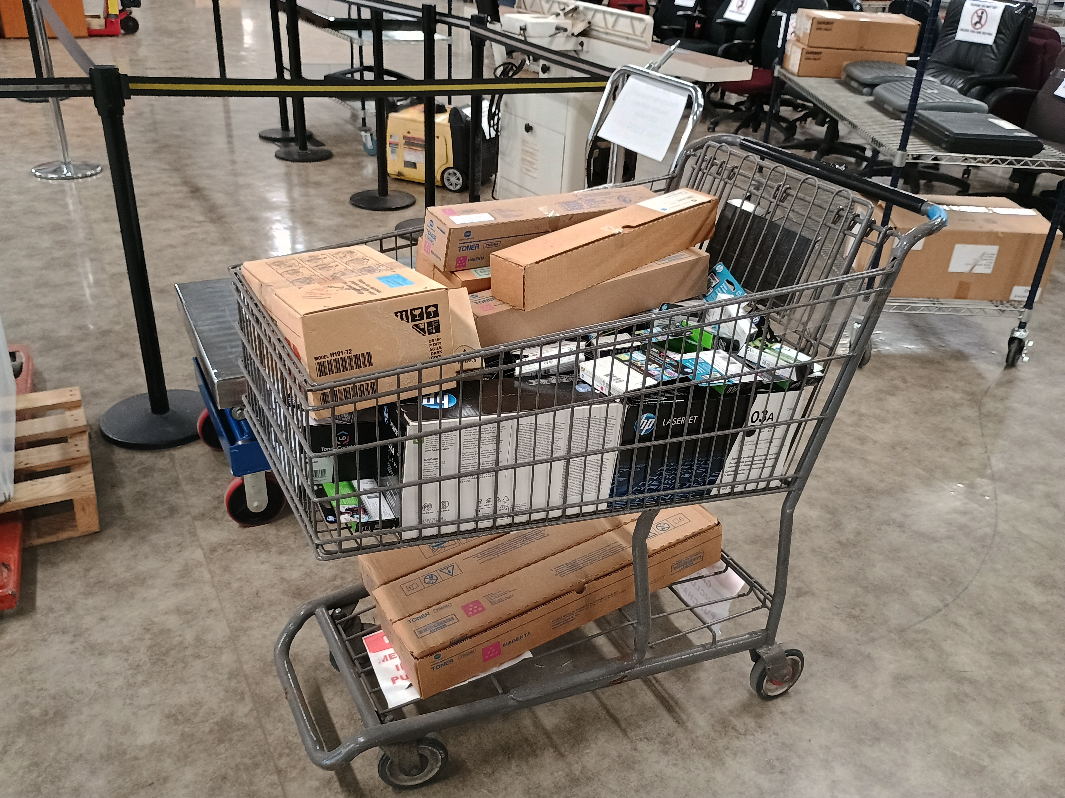 Shopping cart full of inka dn toner boxes.jpg