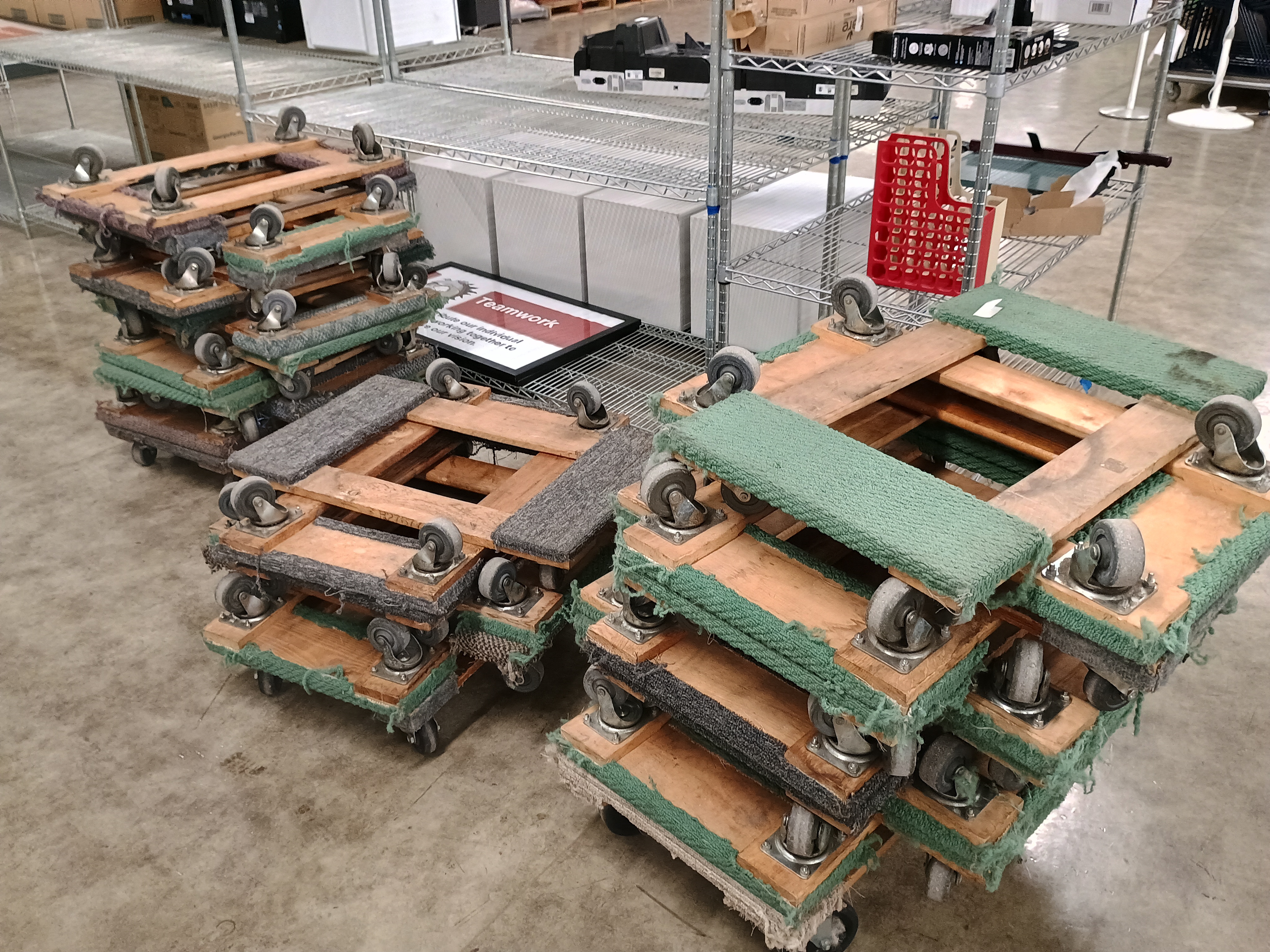 Three stacks of numerous furniture dollies.jpg