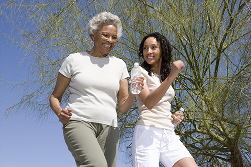 two women walking outdoors
