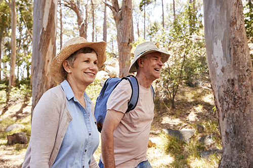 man and woman walking outdoors