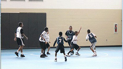Youths playing basketball